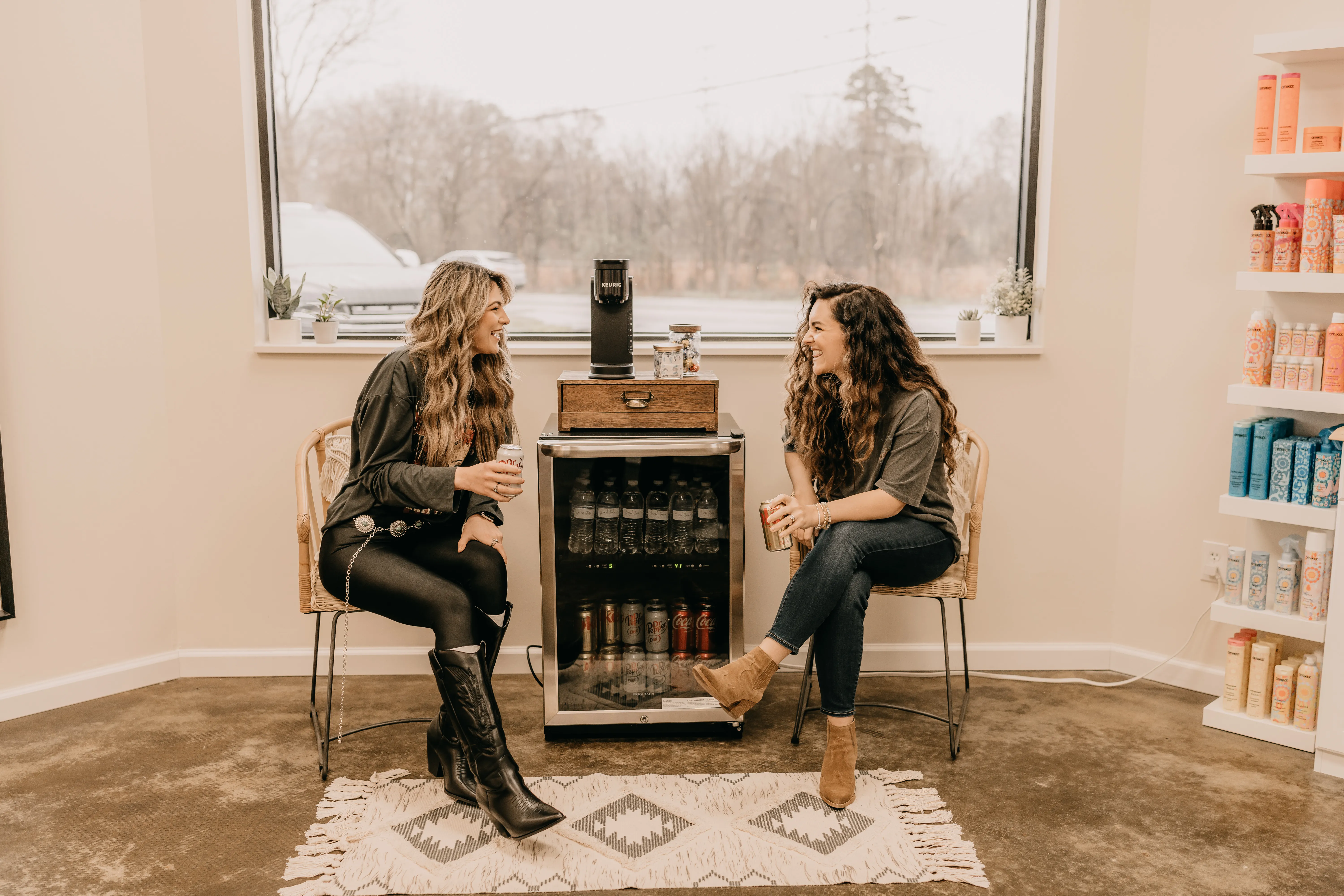 A Graced Studio stylist consulting with a new guest about hair goals
